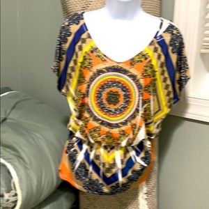 A Blue Sketch peplum cold shoulder shirt.